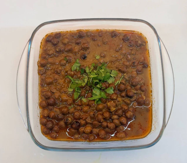 Black chickpea curry finished with coriander